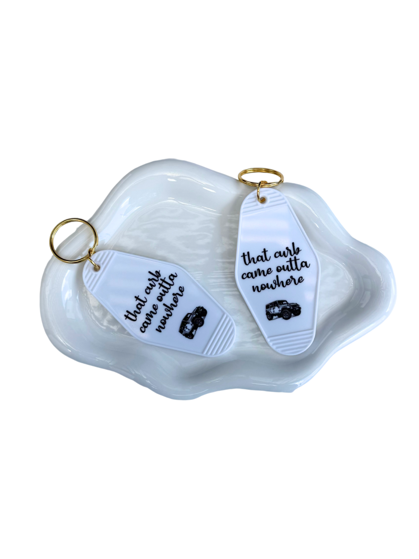 That curb came outta nowhere keychain