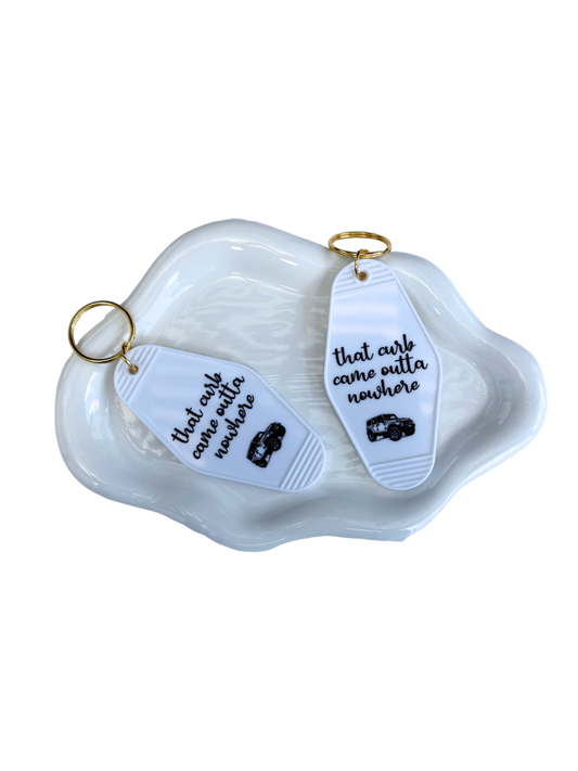 That curb came outta nowhere keychain